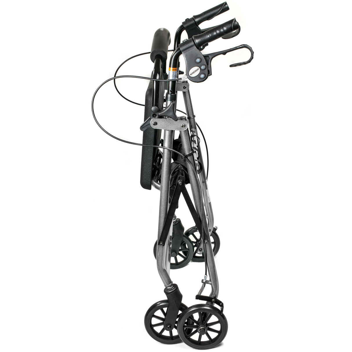 The McKesson Lightweight 4 Wheel Rollator Walker, Silver, features ergonomic handles, black hand brakes with cables, and four black wheels; shown folded for storage or transport against a white background.