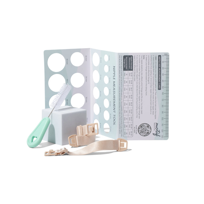 Displayed on a white background are Motif Aura Glow Wearable Breast Pump accessories by Motif: a nipple measurement tool with circular cutouts, cleaning brush with green handle, white block, adjustable beige straps with buckles, and attached ruler.