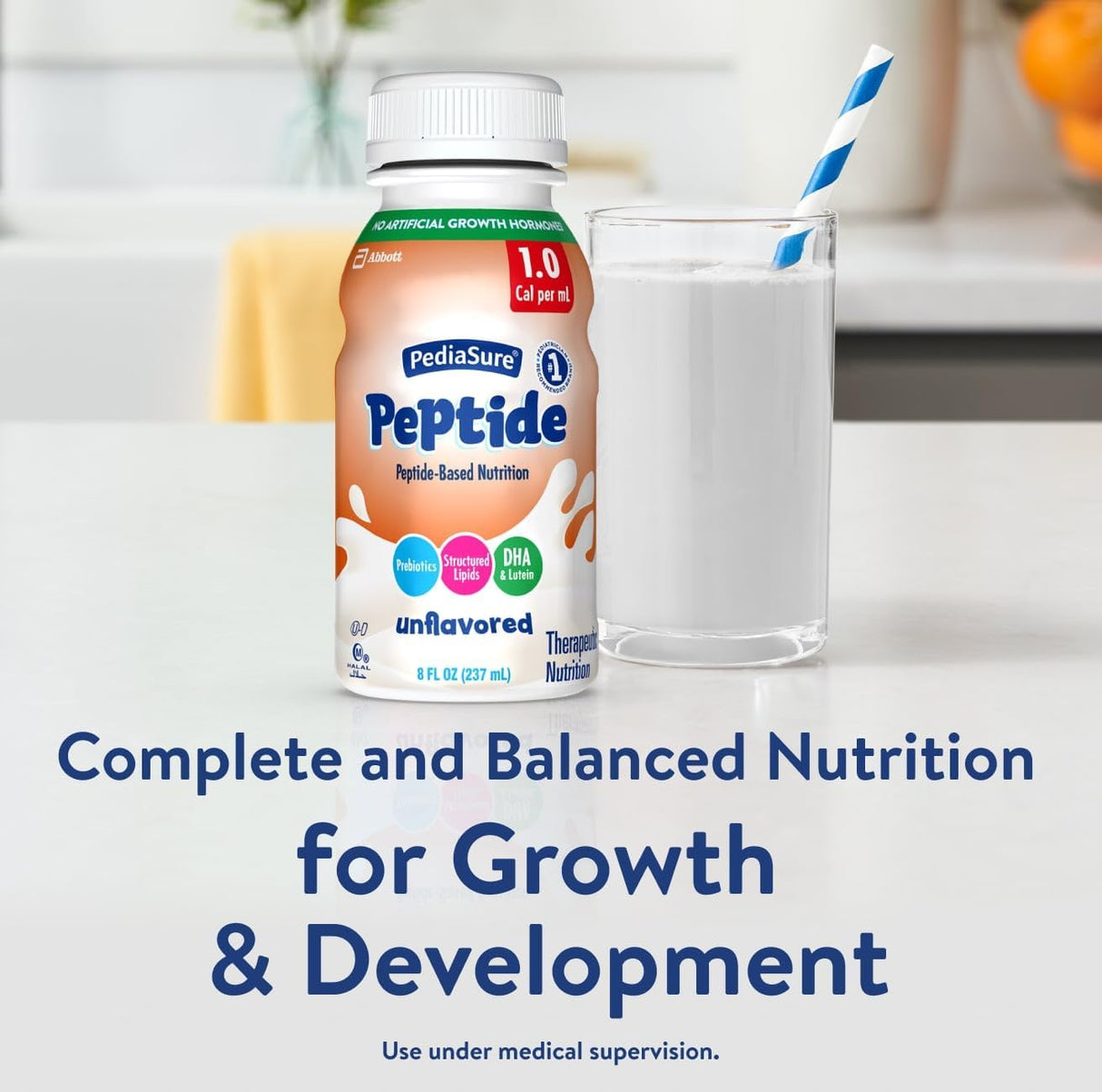 A bottle of Abbott Nutrition PediaSure Peptide 1.0 Cal, Unflavored, is on a table beside a glass of milk with a blue-striped straw. Text reads, “Complete and balanced nutrition with hydrolyzed whey protein for growth & development.”.