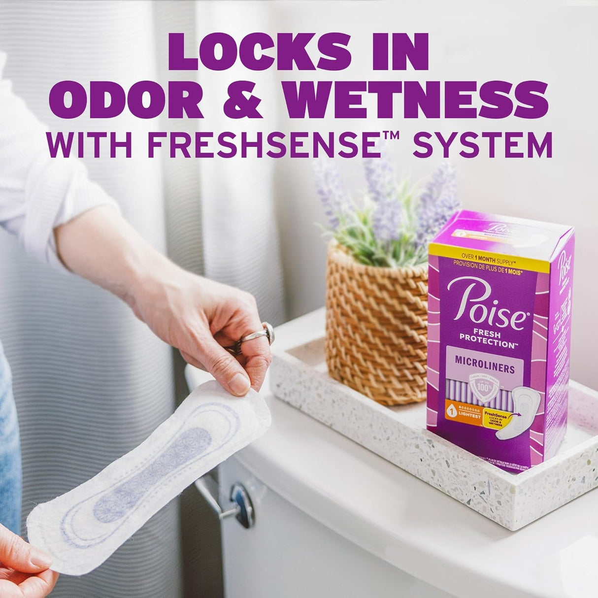 A person holds a Poise Microliners, 1 Drop Lightest Absorbency, Long Length over a toilet beside a tissue box and basket with lavender. Text above reads, LOCKS IN ODOR & WETNESS WITH FRESHSENSE SYSTEM. Poise box is on the tank.