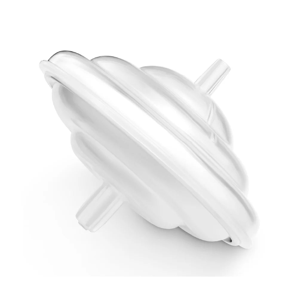A white spinning top toy with a spiral design, shown resting on its side against a plain white background—resembling the smooth curves of the Spectra Wide Neck Breast Flange Kit by Spectra.