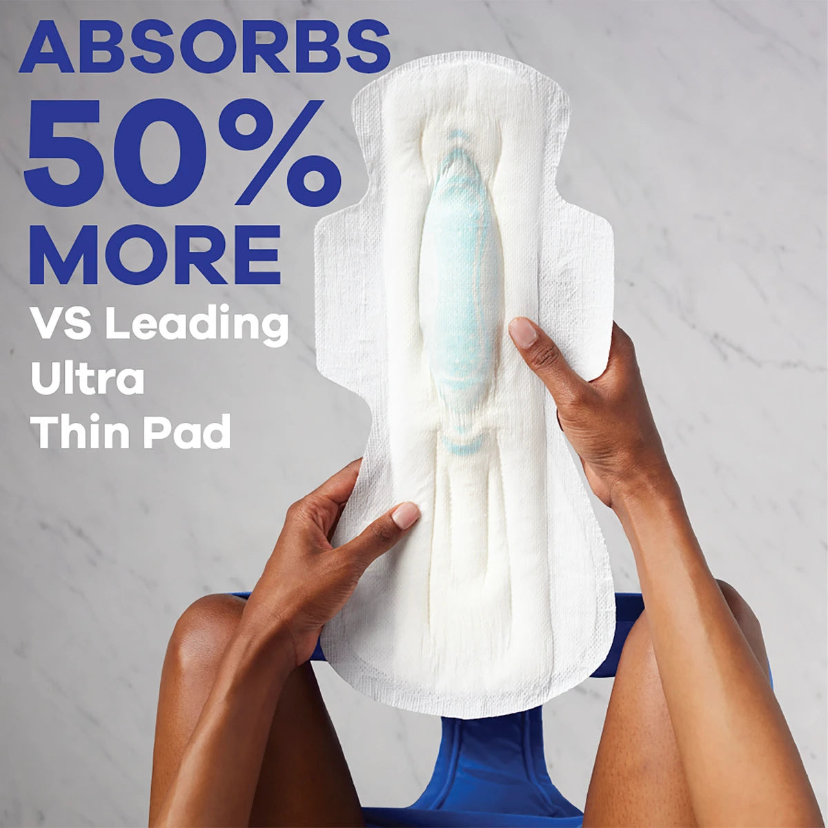 A person on a toilet holds an Always Maxi Size 5 Extra Heavy Overnight Pad with Wings. Text: Absorbs 50% more vs leading ultra thin pad, for leak-free menstrual protection. The scene shows a light bathroom floor.