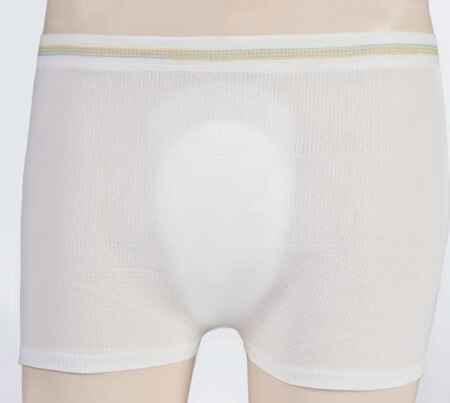 Front view of a mannequin wearing Attends Knit Pants by Attends—white, form-fitting underwear with a green and yellow waistband for pad stability and enhanced comfort.