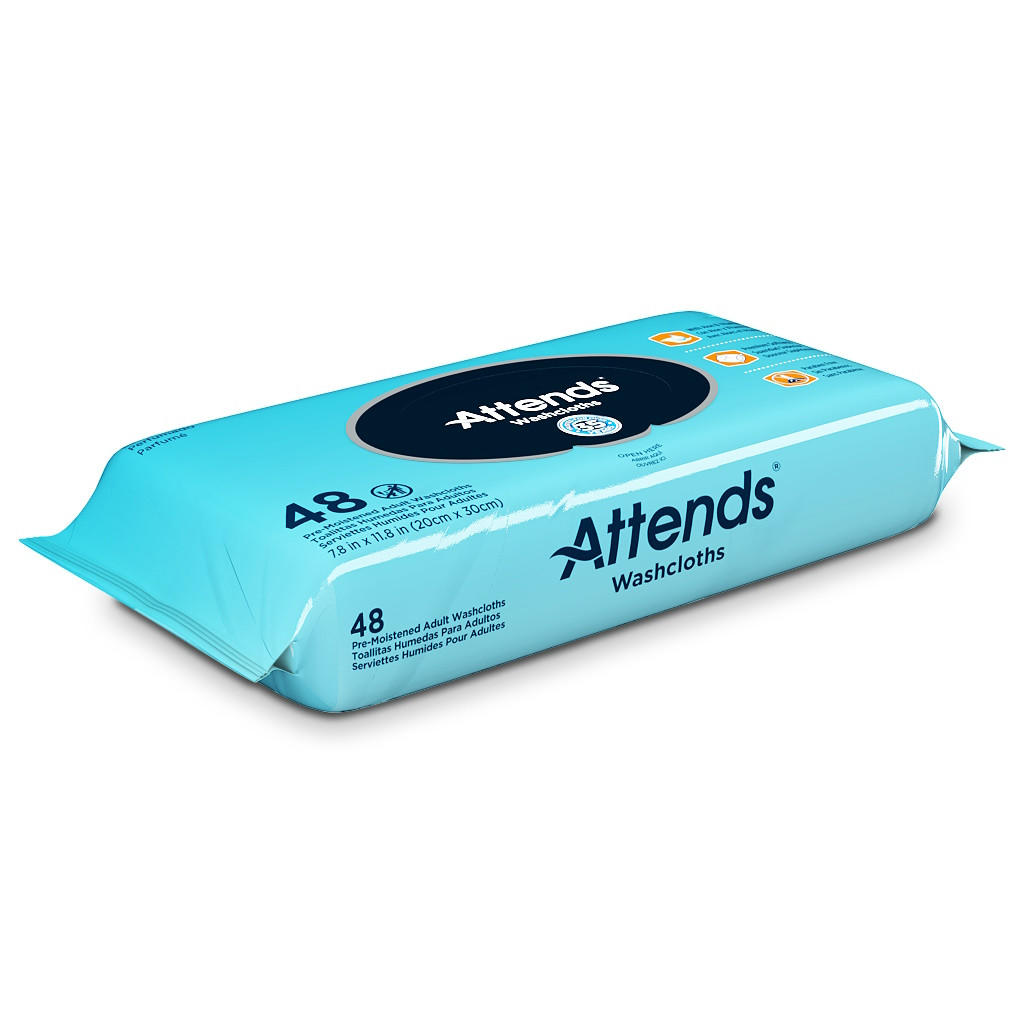 A blue pack of Attends Unscented Washcloths with 48 pre-moistened, pH-balanced wipes is angled slightly to the side, displaying the product name and its features on the packaging.