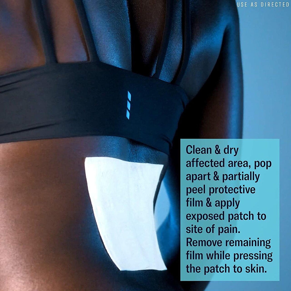 A close-up shows a Biofreeze Professional Pain Relief Patch (Large) applied to a persons lower back, with instructions to use on clean, dry skin for arthritis pain relief. Product by Biofreeze.