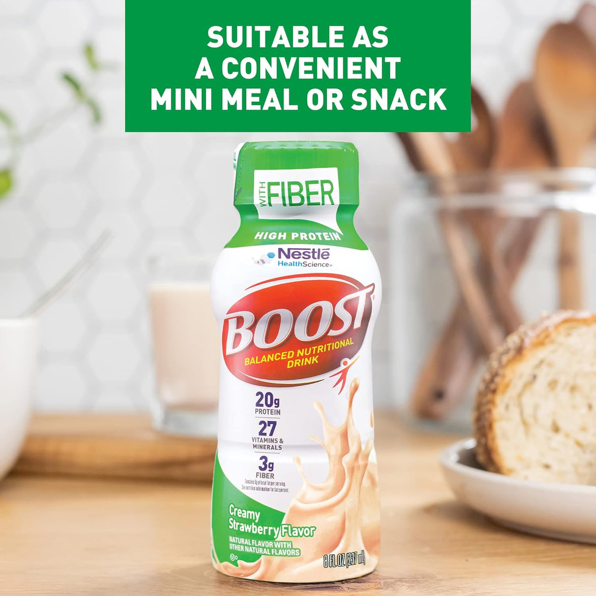 A bottle of Nestle Boost High Protein, Creamy Strawberry, 8 oz, from Nestle Nutrition sits on a wooden table beside sliced bread and a plate. Text above reads: Great as a convenient mini meal or strawberry protein shake snack.