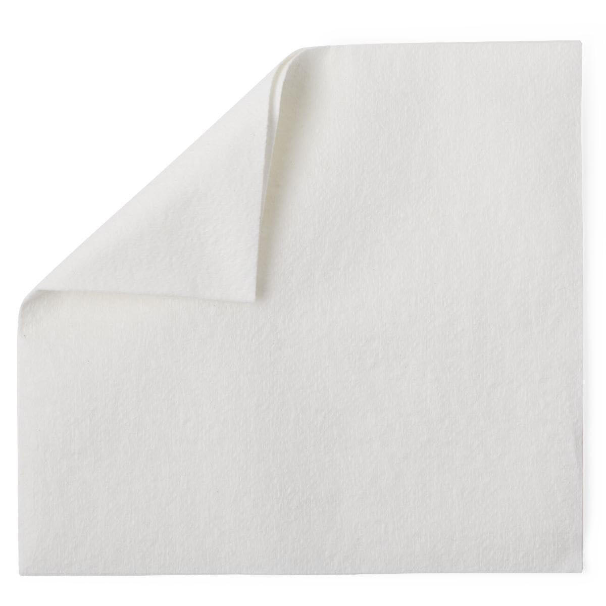 A Cardinal Health Dry Washcloth from Cardinal Health, white and highly absorbent like a plain napkin, is displayed flat with one corner folded over to reveal both sides of the fabric against a white background.