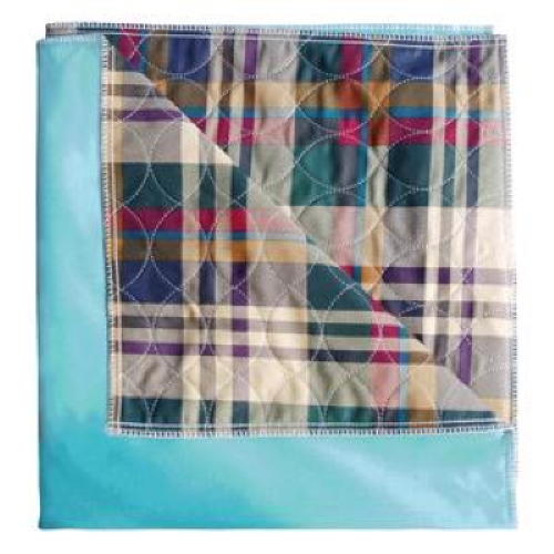 A quilt with a colorful plaid pattern in dark blue, green, red, yellow, and white is bordered and backed by solid light blue fabric—similar to Cardinal Health Essentials Reusable Underpad by Cardinal Health. The quilt is folded to show both sides.