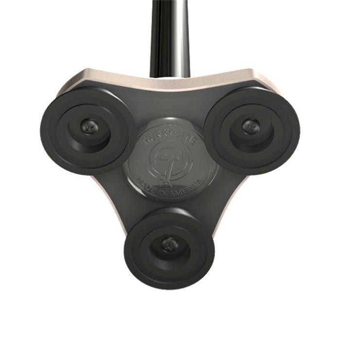 Close-up of a three-wheeled triangular attachment with black wheels and metallic center marked TURFCLEAN MADE IN AMERICA, designed for use with the Drive HurryCane Freedom Edition Folding Cane (30.5-37.5 in), by Drive.