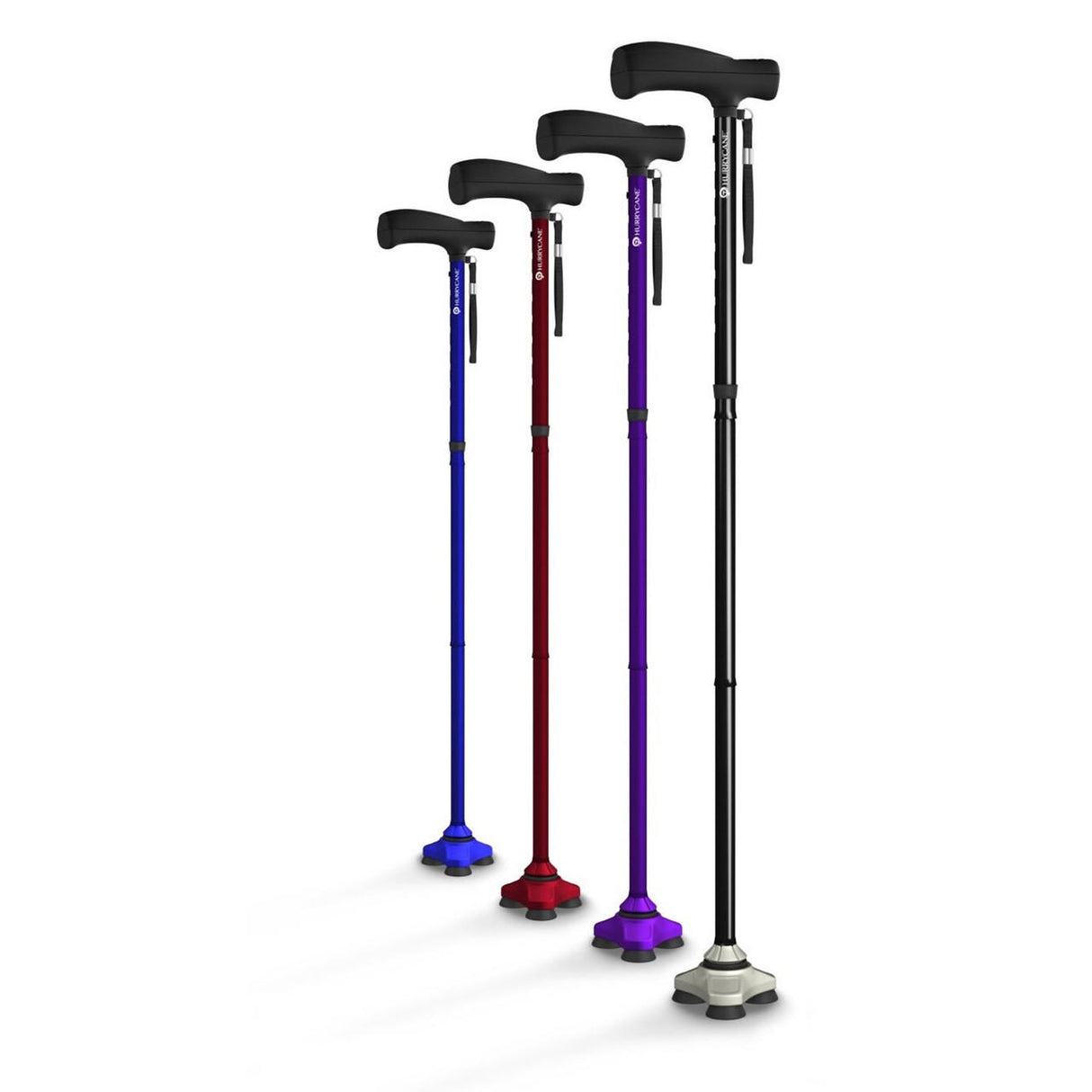 Four Drive HurryCane Freedom Edition Folding Canes in blue, red, purple, and black stand upright; each features a black handle, wrist strap, wide stable base for support, and is adjustable from 30.5 to 37.5 inches in height.