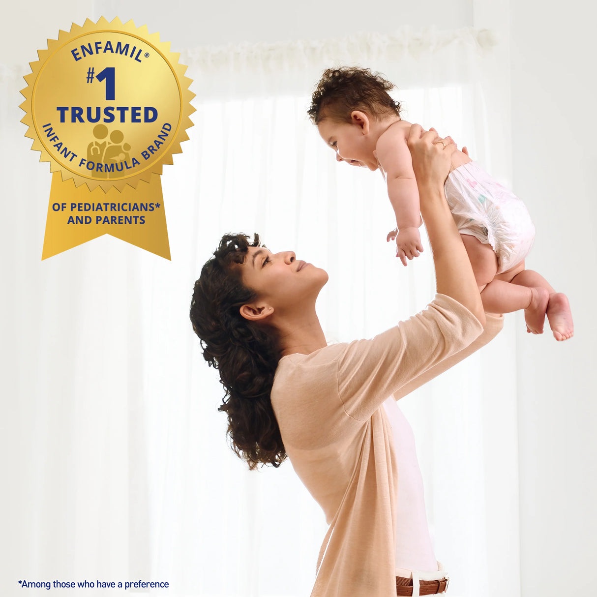 A smiling woman lifts a laughing baby near a window. A gold badge reads, Enfamil #1 Trusted Infant Formula Brand of Pediatricians* and Parents, featuring Enfamil NeuroPro Gentlease Infant Formula, Ready to Use, 6 oz Bottle. Fine print appears below.