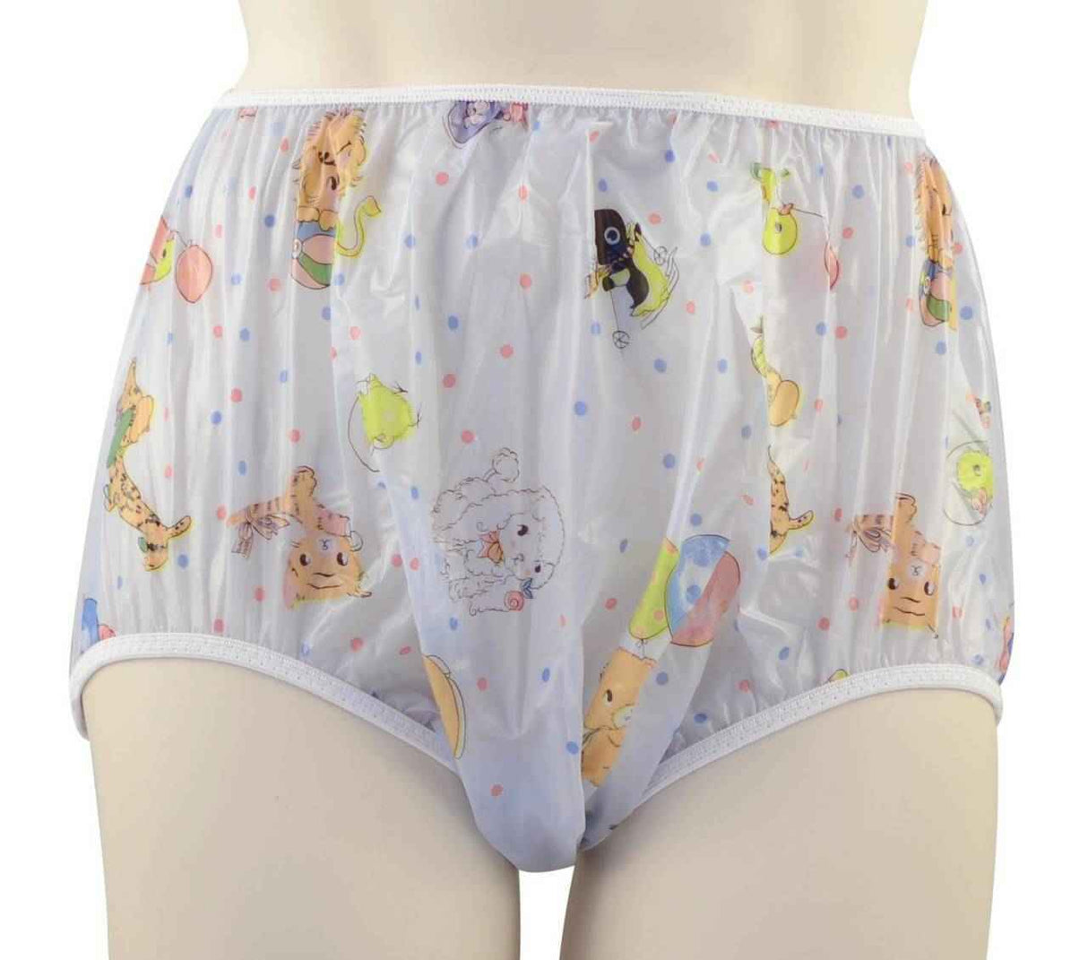 Someone is wearing Gary Pull-On Plastic Pants by Gary, featuring colorful cartoon animal prints and pastel polka dots. These semi-transparent pants have white elastic trim at the waist and legs.
