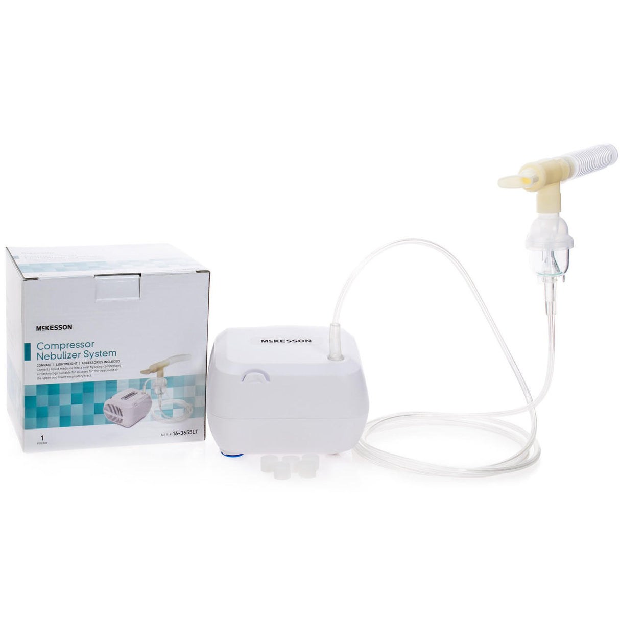 A McKesson Compressor Nebulizer System by McKesson is displayed with its box, main compressor unit, attached tubing, and mouthpiece arranged on a white surface for respiratory therapy.