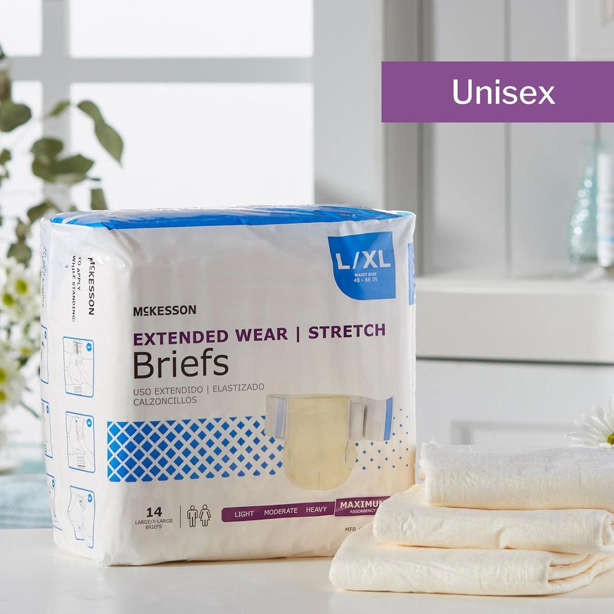 A package of McKesson Extended Wear Stretch Adult Diapers, size L/XL, rests on a bathroom counter beside folded towels and a small plant. The packaging states it contains 14 adult diapers made for maximum absorbency.