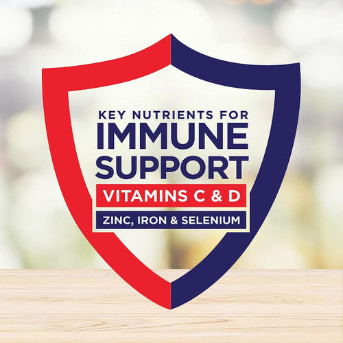 A red and blue shield graphic with the text: Key nutrients for immune support—Vitamins C & D, Zinc, Iron & Selenium—is shown on a blurred wooden background, highlighting Nestle Nutrition Boost Very High Calorie (VHC), Chocolate, 8 oz Carton.