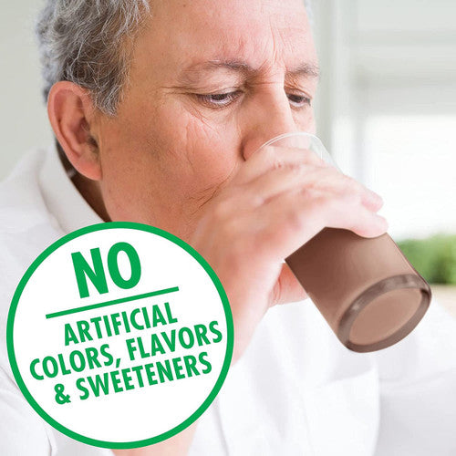 An older adult enjoys a glass of Nestle Boost Very High Calorie (VHC), Chocolate, 8 oz by Nestle Nutrition. In front, a green circle reads: NO ARTIFICIAL COLORS, FLAVORS & SWEETENERS.