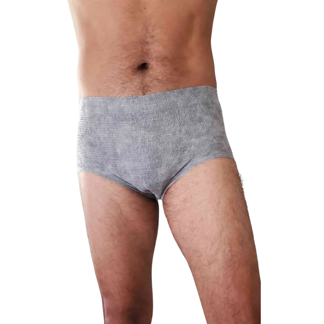 A person is shown from mid-chest to mid-thigh, wearing Nexwear Mens Incontinence Underwear—a high-waisted, gray absorbent product—against a white background.