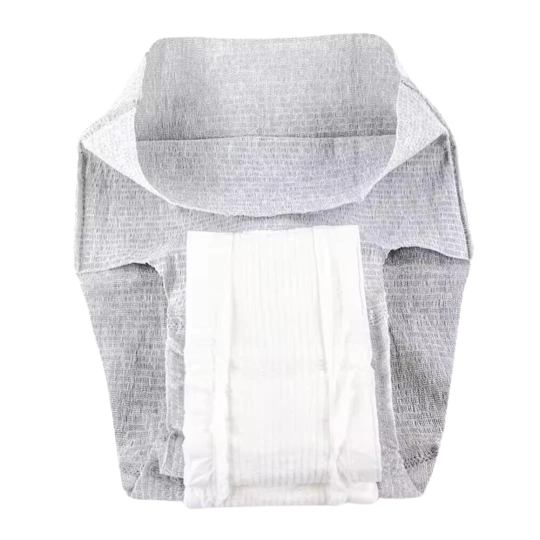 A disposable adult diaper is opened and laid flat on a white background, displaying its absorbent core and soft cover, similar to Nexwear Mens Incontinence Underwear from Nexwear, designed for mens incontinence protection.