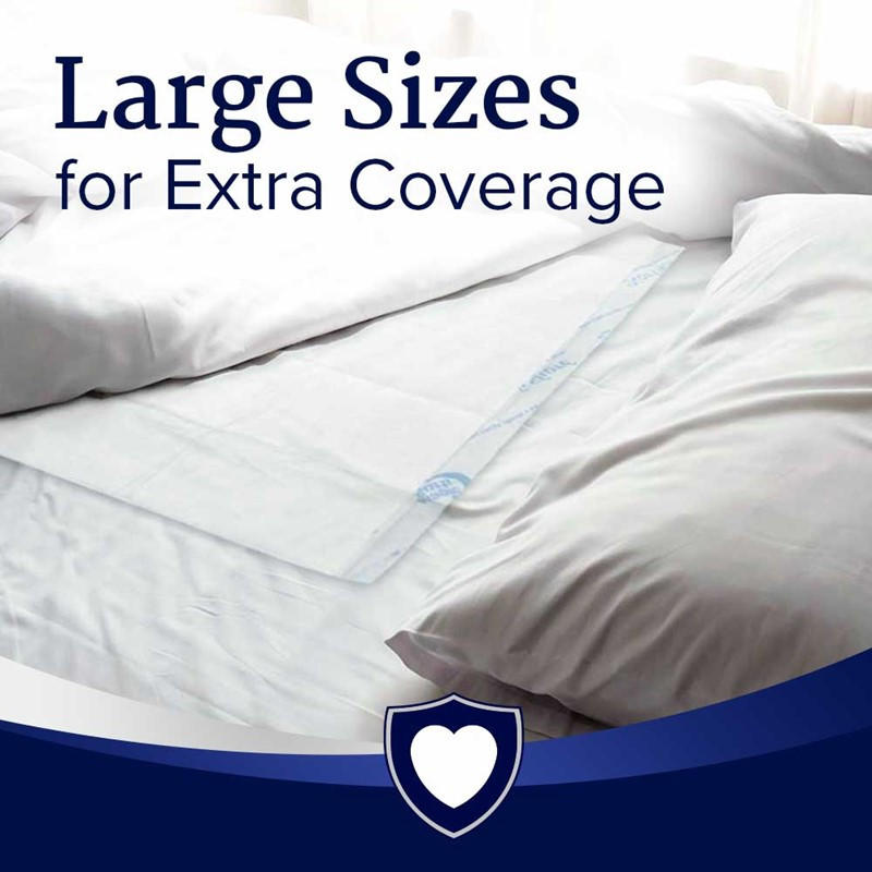 A bed with white sheets and pillows features a NorthShore MagicSorb Air Super-Absorbent Disposable Underpad for extra coverage. Large Sizes for Extra Coverage text appears, with a heart-shaped shield icon at the bottom.