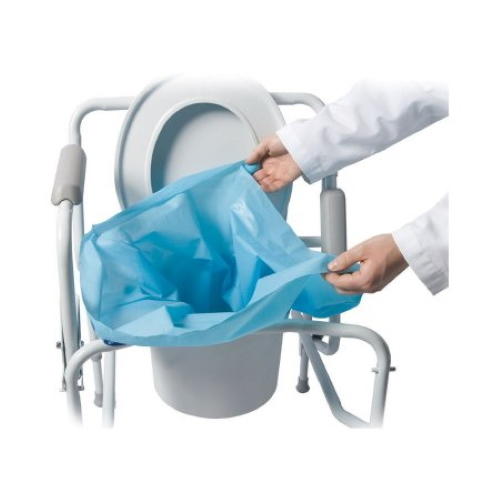 A person in a white coat places a blue Cleanwaste Sani-Bag+ Commode Liner into a commode chair.