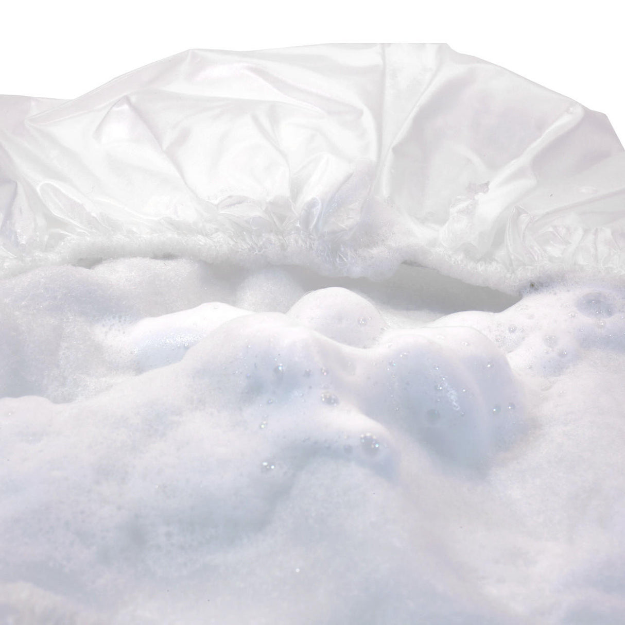 Close-up of white soap bubbles and foam inside the Stryker Sage Rinse-Free Shampoo Cap by Sage Products, illustrating easy, waterless hair care—ideal for those with limited mobility.