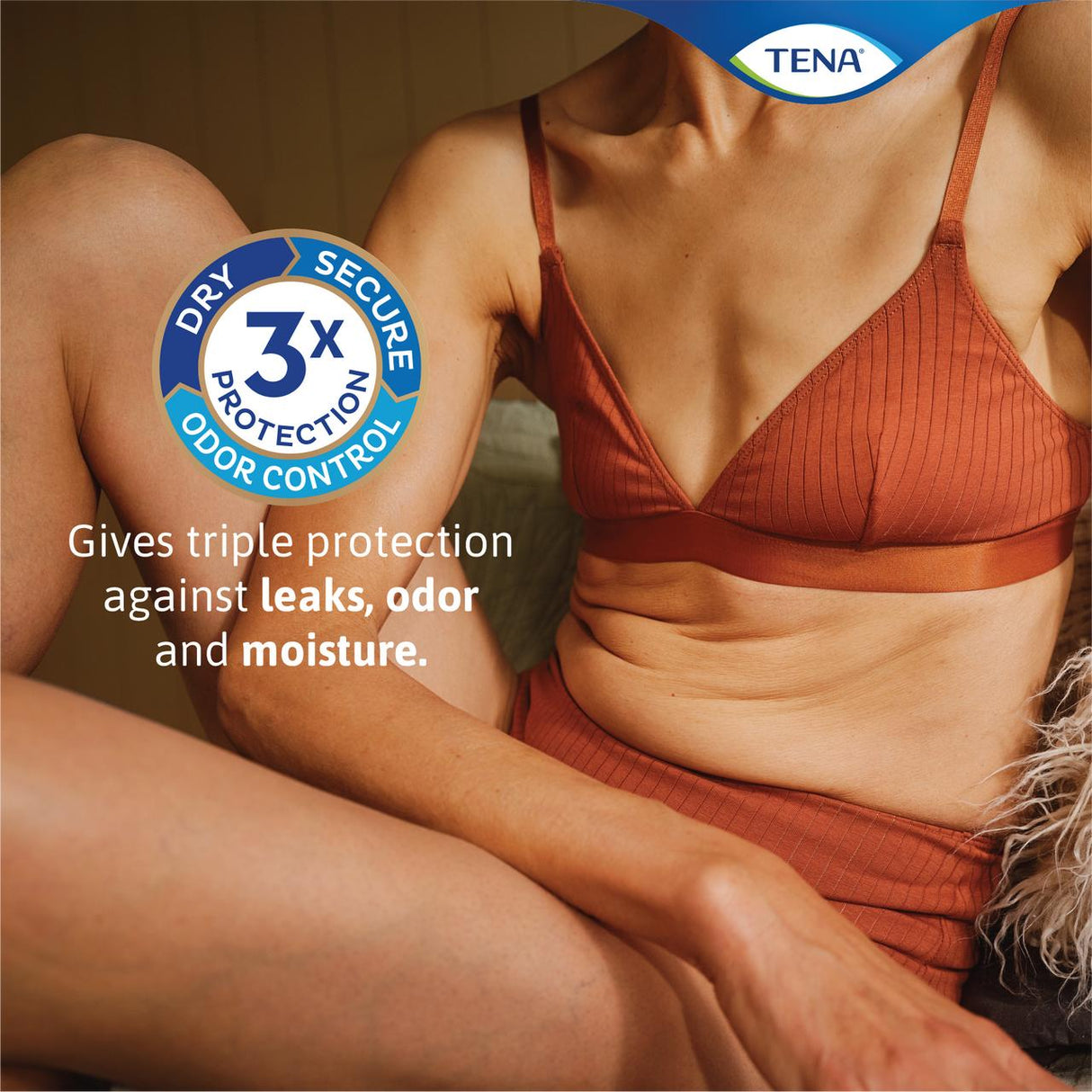 A woman in rust-colored underwear sits on a bed. A badge reads “3x Protection, Dry, Secure, Odor Control.” Text says: “Triple bladder leakage protection.” TENA Sensitive Care Extra Coverage Moderate Incontinence Pads logo appears above.