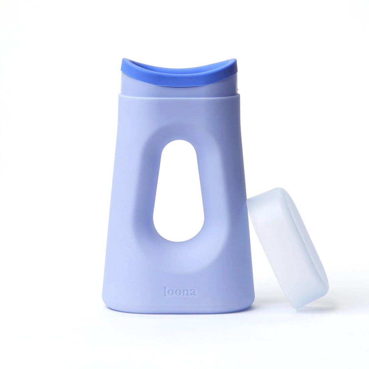 A light blue, oval-shaped travel urinal bottle called The Loona Female Urinal With Closure by Boom Home Medical features a large center cutout, a blue curved flip-top cap, and a translucent cap beside it. The brand loona is embossed on the front bottom.