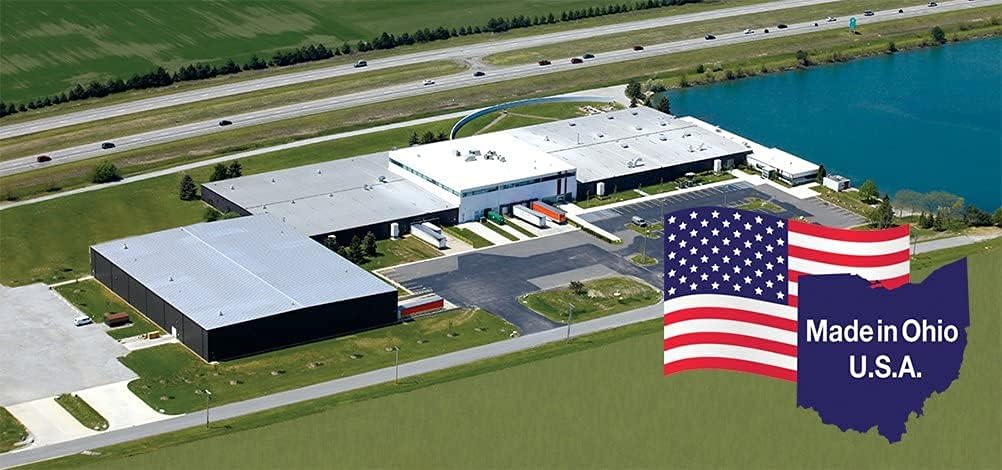Aerial view of a large industrial building by a pond and highway, with a U.S. flag and Made in Ohio U.S.A. marking where Tranquility Essential Underpads, Moderate by Tranquility—trusted absorbent bed protection—are made.