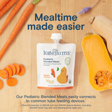 A pouch of Kate Farms Pediatric Blended Meals, Squash & Carrot, CS/12 sits on a wooden surface with fresh carrots, butternut squash, and a feeding tube. Text: "Mealtime made easier with plant-based nutrition—tube feeding compatible.
