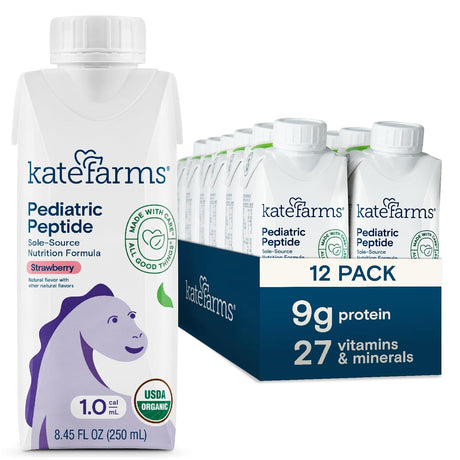 A carton of Kate Farms Pediatric Peptide Formula 1.0, Strawberry, designed for tube feeding and plant-based nutrition, stands before a 12-pack case. The packaging features a purple dinosaur and promotes 9g protein plus 27 vitamins & minerals.