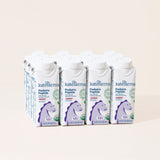 Nine cartons of Kate Farms Pediatric Peptide Formula 1.0, Strawberry are arranged in three rows. The hypoallergenic plant-based children’s formula comes in white cartons featuring a purple horse and green and blue text on the front.